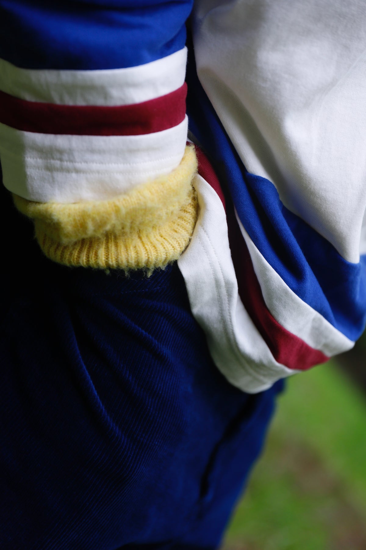 Little Yarmouth EP. 2. A close view of blue, white and yellow layers and a striped cuff.