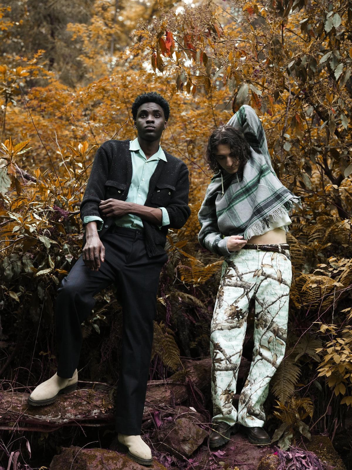Little Yarmouth EP. 2. Two figures in a dark cardigan and a checked head covering among autumn trees.