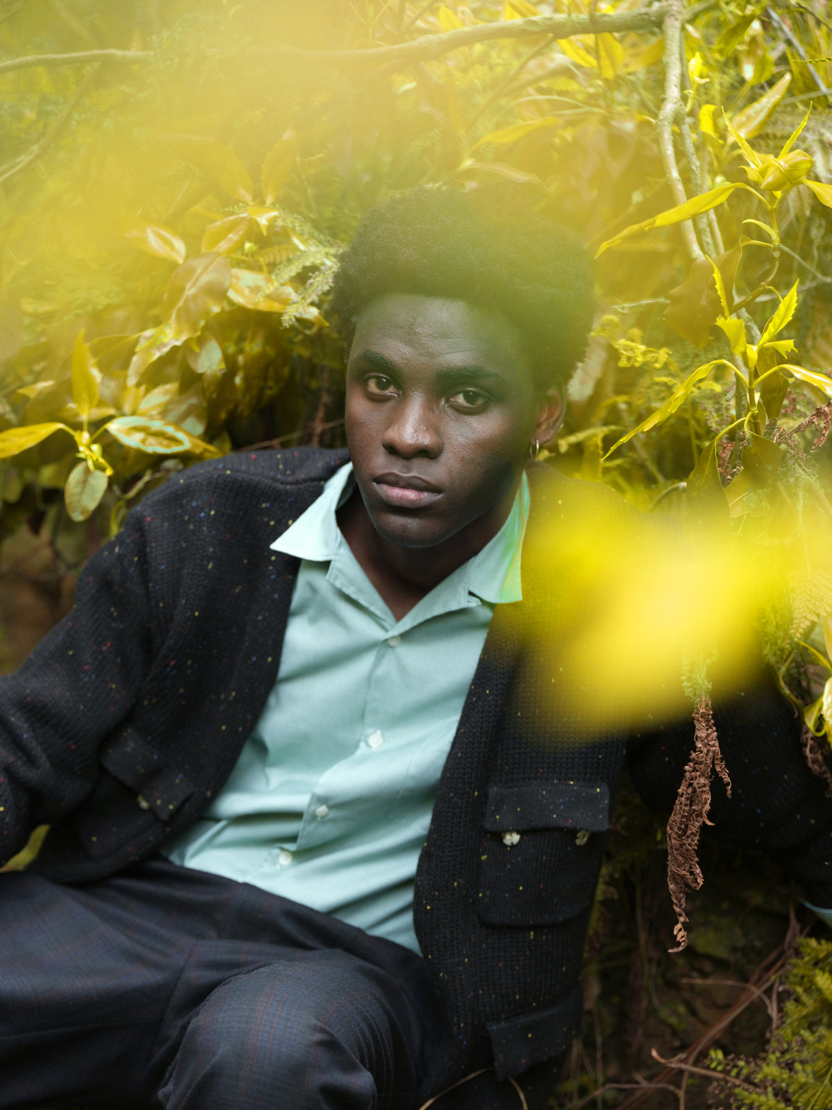 Little Yarmouth EP. 2. A dark cardigan and pale shirt framed by yellow leaves.